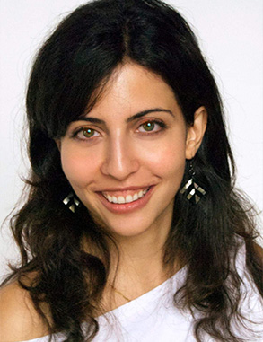 A woman with dark hair and a friendly expression, smiling at the camera.